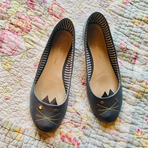 Grey shoes with a cat face